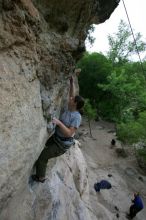 Hannah Norton top rope climbing Diving for Rocks (5.10d), photographed from  the third bolt of Magster (5.10a).  It was another long day of rock climbing at Seismic Wall on Austin's Barton Creek Greenbelt, Saturday, April 11, 2009.

Filename: SRM_20090411_16103150.JPG
Aperture: f/5.0
Shutter Speed: 1/250
Body: Canon EOS-1D Mark II
Lens: Canon EF 16-35mm f/2.8 L