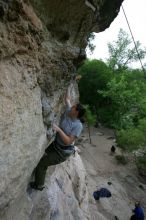 Hannah Norton top rope climbing Diving for Rocks (5.10d), photographed from  the third bolt of Magster (5.10a).  It was another long day of rock climbing at Seismic Wall on Austin's Barton Creek Greenbelt, Saturday, April 11, 2009.

Filename: SRM_20090411_16103151.JPG
Aperture: f/5.0
Shutter Speed: 1/250
Body: Canon EOS-1D Mark II
Lens: Canon EF 16-35mm f/2.8 L