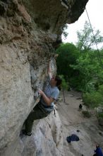 Hannah Norton top rope climbing Diving for Rocks (5.10d), photographed from  the third bolt of Magster (5.10a).  It was another long day of rock climbing at Seismic Wall on Austin's Barton Creek Greenbelt, Saturday, April 11, 2009.

Filename: SRM_20090411_16103152.JPG
Aperture: f/5.0
Shutter Speed: 1/250
Body: Canon EOS-1D Mark II
Lens: Canon EF 16-35mm f/2.8 L