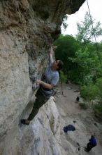 Hannah Norton top rope climbing Diving for Rocks (5.10d), photographed from  the third bolt of Magster (5.10a).  It was another long day of rock climbing at Seismic Wall on Austin's Barton Creek Greenbelt, Saturday, April 11, 2009.

Filename: SRM_20090411_16103454.JPG
Aperture: f/5.0
Shutter Speed: 1/250
Body: Canon EOS-1D Mark II
Lens: Canon EF 16-35mm f/2.8 L