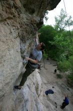 Hannah Norton top rope climbing Diving for Rocks (5.10d), photographed from  the third bolt of Magster (5.10a).  It was another long day of rock climbing at Seismic Wall on Austin's Barton Creek Greenbelt, Saturday, April 11, 2009.

Filename: SRM_20090411_16103555.JPG
Aperture: f/5.0
Shutter Speed: 1/250
Body: Canon EOS-1D Mark II
Lens: Canon EF 16-35mm f/2.8 L