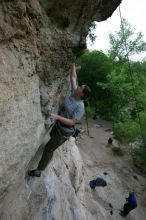 Hannah Norton top rope climbing Diving for Rocks (5.10d), photographed from  the third bolt of Magster (5.10a).  It was another long day of rock climbing at Seismic Wall on Austin's Barton Creek Greenbelt, Saturday, April 11, 2009.

Filename: SRM_20090411_16103556.JPG
Aperture: f/5.0
Shutter Speed: 1/250
Body: Canon EOS-1D Mark II
Lens: Canon EF 16-35mm f/2.8 L