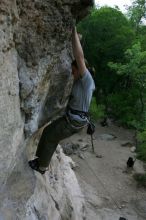 Hannah Norton top rope climbing Diving for Rocks (5.10d), photographed from  the third bolt of Magster (5.10a).  It was another long day of rock climbing at Seismic Wall on Austin's Barton Creek Greenbelt, Saturday, April 11, 2009.

Filename: SRM_20090411_16104957.JPG
Aperture: f/5.0
Shutter Speed: 1/250
Body: Canon EOS-1D Mark II
Lens: Canon EF 16-35mm f/2.8 L