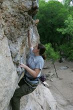 Hannah Norton top rope climbing Diving for Rocks (5.10d), photographed from  the third bolt of Magster (5.10a).  It was another long day of rock climbing at Seismic Wall on Austin's Barton Creek Greenbelt, Saturday, April 11, 2009.

Filename: SRM_20090411_16133263.JPG
Aperture: f/4.0
Shutter Speed: 1/250
Body: Canon EOS-1D Mark II
Lens: Canon EF 16-35mm f/2.8 L