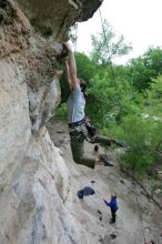 Hannah Norton top rope climbing Diving for Rocks (5.10d), photographed from  the third bolt of Magster (5.10a).  It was another long day of rock climbing at Seismic Wall on Austin's Barton Creek Greenbelt, Saturday, April 11, 2009.

Filename: SRM_20090411_16134168.JPG
Aperture: f/4.0
Shutter Speed: 1/250
Body: Canon EOS-1D Mark II
Lens: Canon EF 16-35mm f/2.8 L