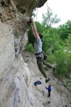 Hannah Norton top rope climbing Diving for Rocks (5.10d), photographed from  the third bolt of Magster (5.10a).  It was another long day of rock climbing at Seismic Wall on Austin's Barton Creek Greenbelt, Saturday, April 11, 2009.

Filename: SRM_20090411_16134170.JPG
Aperture: f/4.0
Shutter Speed: 1/250
Body: Canon EOS-1D Mark II
Lens: Canon EF 16-35mm f/2.8 L