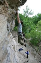 Hannah Norton top rope climbing Diving for Rocks (5.10d), photographed from  the third bolt of Magster (5.10a).  It was another long day of rock climbing at Seismic Wall on Austin's Barton Creek Greenbelt, Saturday, April 11, 2009.

Filename: SRM_20090411_16134172.JPG
Aperture: f/4.0
Shutter Speed: 1/250
Body: Canon EOS-1D Mark II
Lens: Canon EF 16-35mm f/2.8 L