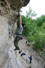 Hannah Norton top rope climbing Diving for Rocks (5.10d), photographed from  the third bolt of Magster (5.10a).  It was another long day of rock climbing at Seismic Wall on Austin's Barton Creek Greenbelt, Saturday, April 11, 2009.

Filename: SRM_20090411_16134273.JPG
Aperture: f/4.0
Shutter Speed: 1/250
Body: Canon EOS-1D Mark II
Lens: Canon EF 16-35mm f/2.8 L