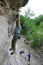 Hannah Norton top rope climbing Diving for Rocks (5.10d), photographed from  the third bolt of Magster (5.10a).  It was another long day of rock climbing at Seismic Wall on Austin's Barton Creek Greenbelt, Saturday, April 11, 2009.

Filename: SRM_20090411_16134274.JPG
Aperture: f/4.0
Shutter Speed: 1/250
Body: Canon EOS-1D Mark II
Lens: Canon EF 16-35mm f/2.8 L