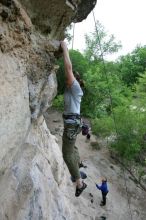 Hannah Norton top rope climbing Diving for Rocks (5.10d), photographed from  the third bolt of Magster (5.10a).  It was another long day of rock climbing at Seismic Wall on Austin's Barton Creek Greenbelt, Saturday, April 11, 2009.

Filename: SRM_20090411_16134376.JPG
Aperture: f/4.0
Shutter Speed: 1/250
Body: Canon EOS-1D Mark II
Lens: Canon EF 16-35mm f/2.8 L