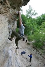 Hannah Norton top rope climbing Diving for Rocks (5.10d), photographed from  the third bolt of Magster (5.10a).  It was another long day of rock climbing at Seismic Wall on Austin's Barton Creek Greenbelt, Saturday, April 11, 2009.

Filename: SRM_20090411_16134477.JPG
Aperture: f/4.0
Shutter Speed: 1/250
Body: Canon EOS-1D Mark II
Lens: Canon EF 16-35mm f/2.8 L