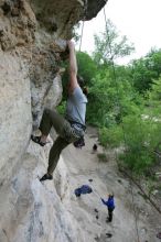 Hannah Norton top rope climbing Diving for Rocks (5.10d), photographed from  the third bolt of Magster (5.10a).  It was another long day of rock climbing at Seismic Wall on Austin's Barton Creek Greenbelt, Saturday, April 11, 2009.

Filename: SRM_20090411_16134478.JPG
Aperture: f/4.0
Shutter Speed: 1/250
Body: Canon EOS-1D Mark II
Lens: Canon EF 16-35mm f/2.8 L