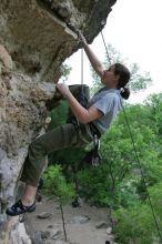 Hannah Norton top rope climbing Diving for Rocks (5.10d), photographed from  the third bolt of Magster (5.10a).  It was another long day of rock climbing at Seismic Wall on Austin's Barton Creek Greenbelt, Saturday, April 11, 2009.

Filename: SRM_20090411_16140581.JPG
Aperture: f/4.0
Shutter Speed: 1/250
Body: Canon EOS-1D Mark II
Lens: Canon EF 16-35mm f/2.8 L