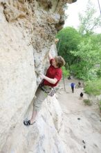 Kirsten Viering top rope climbing Diving for Rocks (5.10d), photographed from  the third bolt of Magster (5.10a).  It was another long day of rock climbing at Seismic Wall on Austin's Barton Creek Greenbelt, Saturday, April 11, 2009.

Filename: SRM_20090411_16191390.JPG
Aperture: f/4.0
Shutter Speed: 1/250
Body: Canon EOS-1D Mark II
Lens: Canon EF 16-35mm f/2.8 L