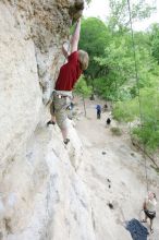 Kirsten Viering top rope climbing Diving for Rocks (5.10d), photographed from  the third bolt of Magster (5.10a).  It was another long day of rock climbing at Seismic Wall on Austin's Barton Creek Greenbelt, Saturday, April 11, 2009.

Filename: SRM_20090411_16191791.JPG
Aperture: f/4.0
Shutter Speed: 1/250
Body: Canon EOS-1D Mark II
Lens: Canon EF 16-35mm f/2.8 L