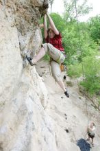 Kirsten Viering top rope climbing Diving for Rocks (5.10d), photographed from  the third bolt of Magster (5.10a).  It was another long day of rock climbing at Seismic Wall on Austin's Barton Creek Greenbelt, Saturday, April 11, 2009.

Filename: SRM_20090411_16192296.JPG
Aperture: f/4.0
Shutter Speed: 1/250
Body: Canon EOS-1D Mark II
Lens: Canon EF 16-35mm f/2.8 L