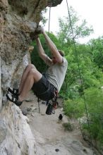 Adam Libson top rope climbing Diving for Rocks (5.10d), photographed from  the third bolt of Magster (5.10a).  It was another long day of rock climbing at Seismic Wall on Austin's Barton Creek Greenbelt, Saturday, April 11, 2009.

Filename: SRM_20090411_16252033.JPG
Aperture: f/5.0
Shutter Speed: 1/400
Body: Canon EOS-1D Mark II
Lens: Canon EF 16-35mm f/2.8 L