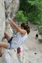 Charlotte Sanders top rope climbing Diving for Rocks (5.10d), photographed from  the third bolt of Magster (5.10a).  It was another long day of rock climbing at Seismic Wall on Austin's Barton Creek Greenbelt, Saturday, April 11, 2009.

Filename: SRM_20090411_16342151.JPG
Aperture: f/5.6
Shutter Speed: 1/320
Body: Canon EOS-1D Mark II
Lens: Canon EF 16-35mm f/2.8 L