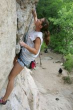 Charlotte Sanders top rope climbing Diving for Rocks (5.10d), photographed from  the third bolt of Magster (5.10a).  It was another long day of rock climbing at Seismic Wall on Austin's Barton Creek Greenbelt, Saturday, April 11, 2009.

Filename: SRM_20090411_16343455.JPG
Aperture: f/5.6
Shutter Speed: 1/320
Body: Canon EOS-1D Mark II
Lens: Canon EF 16-35mm f/2.8 L