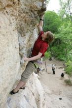 Kirsten Viering top rope climbing Diving for Rocks (5.10d), photographed from  the third bolt of Magster (5.10a).  It was another long day of rock climbing at Seismic Wall on Austin's Barton Creek Greenbelt, Saturday, April 11, 2009.

Filename: SRM_20090411_16374361.JPG
Aperture: f/5.6
Shutter Speed: 1/320
Body: Canon EOS-1D Mark II
Lens: Canon EF 16-35mm f/2.8 L