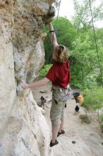 Kirsten Viering top rope climbing Diving for Rocks (5.10d), photographed from  the third bolt of Magster (5.10a).  It was another long day of rock climbing at Seismic Wall on Austin's Barton Creek Greenbelt, Saturday, April 11, 2009.

Filename: SRM_20090411_16374364.JPG
Aperture: f/5.6
Shutter Speed: 1/320
Body: Canon EOS-1D Mark II
Lens: Canon EF 16-35mm f/2.8 L