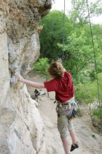 Kirsten Viering top rope climbing Diving for Rocks (5.10d), photographed from  the third bolt of Magster (5.10a).  It was another long day of rock climbing at Seismic Wall on Austin's Barton Creek Greenbelt, Saturday, April 11, 2009.

Filename: SRM_20090411_16374465.JPG
Aperture: f/5.6
Shutter Speed: 1/320
Body: Canon EOS-1D Mark II
Lens: Canon EF 16-35mm f/2.8 L