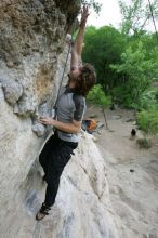 Andrew Dreher top rope climbing Diving for Rocks (5.10d), photographed from  the third bolt of Magster (5.10a).  It was another long day of rock climbing at Seismic Wall on Austin's Barton Creek Greenbelt, Saturday, April 11, 2009.

Filename: SRM_20090411_16423893.JPG
Aperture: f/5.6
Shutter Speed: 1/320
Body: Canon EOS-1D Mark II
Lens: Canon EF 16-35mm f/2.8 L