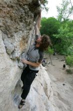 Andrew Dreher top rope climbing Diving for Rocks (5.10d), photographed from  the third bolt of Magster (5.10a).  It was another long day of rock climbing at Seismic Wall on Austin's Barton Creek Greenbelt, Saturday, April 11, 2009.

Filename: SRM_20090411_16423894.JPG
Aperture: f/5.6
Shutter Speed: 1/320
Body: Canon EOS-1D Mark II
Lens: Canon EF 16-35mm f/2.8 L