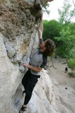 Andrew Dreher top rope climbing Diving for Rocks (5.10d), photographed from  the third bolt of Magster (5.10a).  It was another long day of rock climbing at Seismic Wall on Austin's Barton Creek Greenbelt, Saturday, April 11, 2009.

Filename: SRM_20090411_16423895.JPG
Aperture: f/5.6
Shutter Speed: 1/320
Body: Canon EOS-1D Mark II
Lens: Canon EF 16-35mm f/2.8 L