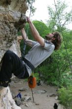 Andrew Dreher top rope climbing Diving for Rocks (5.10d), photographed from  the third bolt of Magster (5.10a).  It was another long day of rock climbing at Seismic Wall on Austin's Barton Creek Greenbelt, Saturday, April 11, 2009.

Filename: SRM_20090411_16424801.JPG
Aperture: f/5.6
Shutter Speed: 1/320
Body: Canon EOS-1D Mark II
Lens: Canon EF 16-35mm f/2.8 L