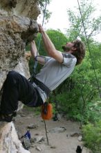 Andrew Dreher top rope climbing Diving for Rocks (5.10d), photographed from  the third bolt of Magster (5.10a).  It was another long day of rock climbing at Seismic Wall on Austin's Barton Creek Greenbelt, Saturday, April 11, 2009.

Filename: SRM_20090411_16424802.JPG
Aperture: f/5.6
Shutter Speed: 1/320
Body: Canon EOS-1D Mark II
Lens: Canon EF 16-35mm f/2.8 L