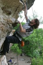 Andrew Dreher top rope climbing Diving for Rocks (5.10d), photographed from  the third bolt of Magster (5.10a).  It was another long day of rock climbing at Seismic Wall on Austin's Barton Creek Greenbelt, Saturday, April 11, 2009.

Filename: SRM_20090411_16425305.JPG
Aperture: f/5.6
Shutter Speed: 1/320
Body: Canon EOS-1D Mark II
Lens: Canon EF 16-35mm f/2.8 L