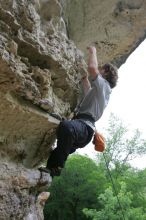 Andrew Dreher top rope climbing Diving for Rocks (5.10d), photographed from  the third bolt of Magster (5.10a).  It was another long day of rock climbing at Seismic Wall on Austin's Barton Creek Greenbelt, Saturday, April 11, 2009.

Filename: SRM_20090411_16430211.JPG
Aperture: f/5.6
Shutter Speed: 1/320
Body: Canon EOS-1D Mark II
Lens: Canon EF 16-35mm f/2.8 L