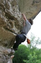 Andrew Dreher top rope climbing Diving for Rocks (5.10d), photographed from  the third bolt of Magster (5.10a).  It was another long day of rock climbing at Seismic Wall on Austin's Barton Creek Greenbelt, Saturday, April 11, 2009.

Filename: SRM_20090411_16430212.JPG
Aperture: f/5.6
Shutter Speed: 1/320
Body: Canon EOS-1D Mark II
Lens: Canon EF 16-35mm f/2.8 L