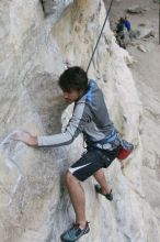 Javier Morales top rope climbing Diving for Rocks (5.10d), photographed from  the third bolt of Magster (5.10a).  It was another long day of rock climbing at Seismic Wall on Austin's Barton Creek Greenbelt, Saturday, April 11, 2009.

Filename: SRM_20090411_16481314.JPG
Aperture: f/5.6
Shutter Speed: 1/320
Body: Canon EOS-1D Mark II
Lens: Canon EF 16-35mm f/2.8 L