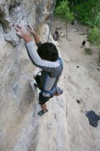 Javier Morales top rope climbing Diving for Rocks (5.10d), photographed from  the third bolt of Magster (5.10a).  It was another long day of rock climbing at Seismic Wall on Austin's Barton Creek Greenbelt, Saturday, April 11, 2009.

Filename: SRM_20090411_16484026.JPG
Aperture: f/5.6
Shutter Speed: 1/320
Body: Canon EOS-1D Mark II
Lens: Canon EF 16-35mm f/2.8 L