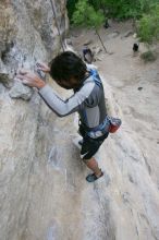 Javier Morales top rope climbing Diving for Rocks (5.10d), photographed from  the third bolt of Magster (5.10a).  It was another long day of rock climbing at Seismic Wall on Austin's Barton Creek Greenbelt, Saturday, April 11, 2009.

Filename: SRM_20090411_16485029.JPG
Aperture: f/5.6
Shutter Speed: 1/320
Body: Canon EOS-1D Mark II
Lens: Canon EF 16-35mm f/2.8 L