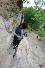 Javier Morales top rope climbing Diving for Rocks (5.10d), photographed from  the third bolt of Magster (5.10a).  It was another long day of rock climbing at Seismic Wall on Austin's Barton Creek Greenbelt, Saturday, April 11, 2009.

Filename: SRM_20090411_16485337.JPG
Aperture: f/5.6
Shutter Speed: 1/320
Body: Canon EOS-1D Mark II
Lens: Canon EF 16-35mm f/2.8 L