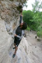 Javier Morales top rope climbing Diving for Rocks (5.10d), photographed from  the third bolt of Magster (5.10a).  It was another long day of rock climbing at Seismic Wall on Austin's Barton Creek Greenbelt, Saturday, April 11, 2009.

Filename: SRM_20090411_16485338.JPG
Aperture: f/5.6
Shutter Speed: 1/320
Body: Canon EOS-1D Mark II
Lens: Canon EF 16-35mm f/2.8 L