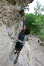 Javier Morales top rope climbing Diving for Rocks (5.10d), photographed from  the third bolt of Magster (5.10a).  It was another long day of rock climbing at Seismic Wall on Austin's Barton Creek Greenbelt, Saturday, April 11, 2009.

Filename: SRM_20090411_16485439.JPG
Aperture: f/5.6
Shutter Speed: 1/320
Body: Canon EOS-1D Mark II
Lens: Canon EF 16-35mm f/2.8 L