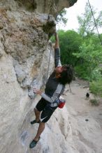 Javier Morales top rope climbing Diving for Rocks (5.10d), photographed from  the third bolt of Magster (5.10a).  It was another long day of rock climbing at Seismic Wall on Austin's Barton Creek Greenbelt, Saturday, April 11, 2009.

Filename: SRM_20090411_16485441.JPG
Aperture: f/5.6
Shutter Speed: 1/320
Body: Canon EOS-1D Mark II
Lens: Canon EF 16-35mm f/2.8 L