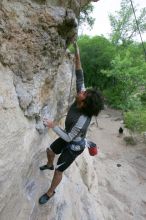 Javier Morales top rope climbing Diving for Rocks (5.10d), photographed from  the third bolt of Magster (5.10a).  It was another long day of rock climbing at Seismic Wall on Austin's Barton Creek Greenbelt, Saturday, April 11, 2009.

Filename: SRM_20090411_16485442.JPG
Aperture: f/5.6
Shutter Speed: 1/320
Body: Canon EOS-1D Mark II
Lens: Canon EF 16-35mm f/2.8 L