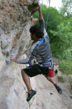 Javier Morales top rope climbing Diving for Rocks (5.10d), photographed from  the third bolt of Magster (5.10a).  It was another long day of rock climbing at Seismic Wall on Austin's Barton Creek Greenbelt, Saturday, April 11, 2009.

Filename: SRM_20090411_16491553.JPG
Aperture: f/5.6
Shutter Speed: 1/320
Body: Canon EOS-1D Mark II
Lens: Canon EF 16-35mm f/2.8 L