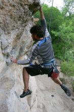 Javier Morales top rope climbing Diving for Rocks (5.10d), photographed from  the third bolt of Magster (5.10a).  It was another long day of rock climbing at Seismic Wall on Austin's Barton Creek Greenbelt, Saturday, April 11, 2009.

Filename: SRM_20090411_16491555.JPG
Aperture: f/5.6
Shutter Speed: 1/320
Body: Canon EOS-1D Mark II
Lens: Canon EF 16-35mm f/2.8 L