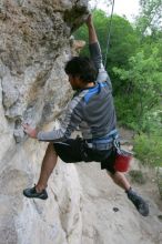 Javier Morales top rope climbing Diving for Rocks (5.10d), photographed from  the third bolt of Magster (5.10a).  It was another long day of rock climbing at Seismic Wall on Austin's Barton Creek Greenbelt, Saturday, April 11, 2009.

Filename: SRM_20090411_16491556.JPG
Aperture: f/5.6
Shutter Speed: 1/320
Body: Canon EOS-1D Mark II
Lens: Canon EF 16-35mm f/2.8 L