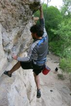 Javier Morales top rope climbing Diving for Rocks (5.10d), photographed from  the third bolt of Magster (5.10a).  It was another long day of rock climbing at Seismic Wall on Austin's Barton Creek Greenbelt, Saturday, April 11, 2009.

Filename: SRM_20090411_16491657.JPG
Aperture: f/5.6
Shutter Speed: 1/320
Body: Canon EOS-1D Mark II
Lens: Canon EF 16-35mm f/2.8 L