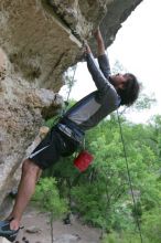 Javier Morales top rope climbing Diving for Rocks (5.10d), photographed from  the third bolt of Magster (5.10a).  It was another long day of rock climbing at Seismic Wall on Austin's Barton Creek Greenbelt, Saturday, April 11, 2009.

Filename: SRM_20090411_16493165.JPG
Aperture: f/5.6
Shutter Speed: 1/320
Body: Canon EOS-1D Mark II
Lens: Canon EF 16-35mm f/2.8 L
