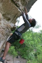 Javier Morales top rope climbing Diving for Rocks (5.10d), photographed from  the third bolt of Magster (5.10a).  It was another long day of rock climbing at Seismic Wall on Austin's Barton Creek Greenbelt, Saturday, April 11, 2009.

Filename: SRM_20090411_16493166.JPG
Aperture: f/5.6
Shutter Speed: 1/320
Body: Canon EOS-1D Mark II
Lens: Canon EF 16-35mm f/2.8 L