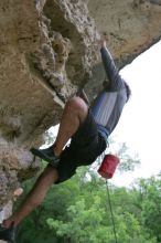 Javier Morales top rope climbing Diving for Rocks (5.10d), photographed from  the third bolt of Magster (5.10a).  It was another long day of rock climbing at Seismic Wall on Austin's Barton Creek Greenbelt, Saturday, April 11, 2009.

Filename: SRM_20090411_16493667.JPG
Aperture: f/5.6
Shutter Speed: 1/320
Body: Canon EOS-1D Mark II
Lens: Canon EF 16-35mm f/2.8 L