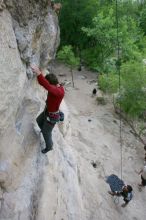 Me top rope climbing Diving for Rocks (5.10d) with Javier Morales belaying, photographed from  the third bolt of Magster (5.10a) by Andrew Dreher.  It was another long day of rock climbing at Seismic Wall on Austin's Barton Creek Greenbelt, Saturday, April 11, 2009.

Filename: SRM_20090411_17045890.JPG
Aperture: f/5.6
Shutter Speed: 1/320
Body: Canon EOS-1D Mark II
Lens: Canon EF 16-35mm f/2.8 L